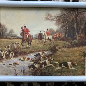 Tiny plastic picture frame with English hunting dogs crossing stream artwork.